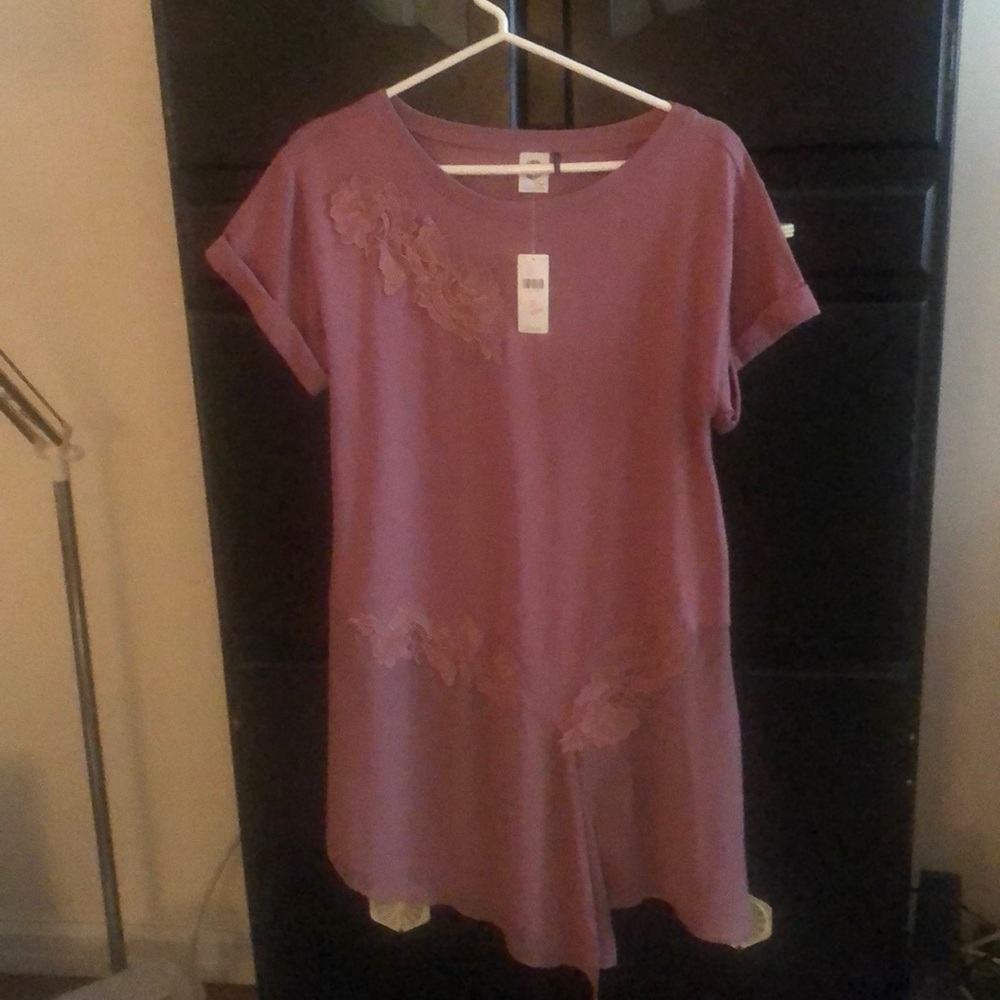 Blush colored asymmetrical dress.